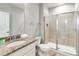 Bathroom featuring a sink with granite countertops, toilet and a walk-in shower at 482 Captiva Dr, Davenport, FL 33836