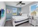 Bedroom with a queen-sized bed, ceiling fan, and TV and a window providing natural light at 482 Captiva Dr, Davenport, FL 33836
