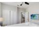 Bedroom with a TV, closet, and access to the en-suite bathroom creating a private retreat at 482 Captiva Dr, Davenport, FL 33836