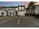 Modern townhome with neutral paint, blue accents, palm trees and parking at 482 Captiva Dr, Davenport, FL 33836