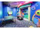 This game room includes a pool table, ping pong, and colorful decor for Gathering fun at 482 Captiva Dr, Davenport, FL 33836