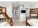 View of the hallway with bunkbeds, carpet and doors with access to other rooms at 482 Captiva Dr, Davenport, FL 33836