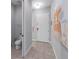 Hallway that leads to the front door, powder bath, and is decorated with art at 482 Captiva Dr, Davenport, FL 33836