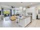 Open concept kitchen with island, granite countertops, and stainless appliances at 482 Captiva Dr, Davenport, FL 33836