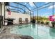 Enjoy this screened-in pool with a BBQ grill and outdoor chairs, perfect for entertaining at 482 Captiva Dr, Davenport, FL 33836