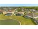 Backyard features private screened pools with serene lake views nestled in a vibrant community at 5335 Coral Vine Ln, Kissimmee, FL 34758