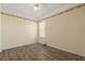 Bedroom with ceiling fan, wood-look floors and decorative border along the top of the wall at 5335 Coral Vine Ln, Kissimmee, FL 34758