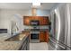 Updated kitchen with granite counters, stainless appliances, and ample storage at 5335 Coral Vine Ln, Kissimmee, FL 34758