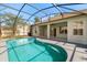 Inviting screened pool area with a covered patio, perfect for relaxing and entertaining at 5335 Coral Vine Ln, Kissimmee, FL 34758