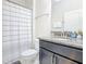 Bathroom featuring a shower and tub combination, granite counter tops, and a dark wood vanity at 5412 Solterra Cir, Davenport, FL 33837