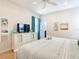 Bright bedroom with white furniture, ceiling fan, carpet, and tasteful decor for a relaxing ambiance at 5412 Solterra Cir, Davenport, FL 33837