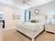 Well-lit bedroom with white furniture, ceiling fan, carpet, and tasteful decor for a relaxing ambiance at 5412 Solterra Cir, Davenport, FL 33837