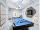 The garage has been transformed to include a foosball table and a pool table and Star Wars themed decorations at 5412 Solterra Cir, Davenport, FL 33837