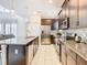 Spacious kitchen with granite countertops, stainless steel appliances, and modern cabinetry at 5412 Solterra Cir, Davenport, FL 33837