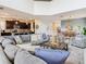 Open-concept living room flowing into dining room and kitchen featuring comfortable seating at 5412 Solterra Cir, Davenport, FL 33837