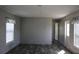 Bright living room with wood-look flooring and neutral walls at 5870 Cypress Shores Ct, Orlando, FL 32839