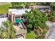 Aerial view showcasing a condo, patio with outdoor dining, and lush landscaping at 601 W Old Us Highway 441 # 9B, Mount Dora, FL 32757