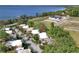 Aerial view of waterfront condos close to an adjacent residential construction site near a scenic lake at 601 W Old Us Highway 441 # 9B, Mount Dora, FL 32757