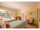 Bright bedroom with two twin beds and sliding door access to outdoor space at 601 W Old Us Highway 441 # 9B, Mount Dora, FL 32757