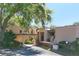 Well-maintained condo exterior with lush landscaping and a covered carport at 601 W Old Us Highway 441 # 9B, Mount Dora, FL 32757