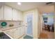 This is a view of the kitchen which has an entry to the outside through the door at 601 W Old Us Highway 441 # 9B, Mount Dora, FL 32757