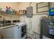 Functional laundry room with washer, dryer, and shelving for storage at 601 W Old Us Highway 441 # 9B, Mount Dora, FL 32757