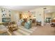Spacious living room featuring coordinated furniture and ample natural light at 601 W Old Us Highway 441 # 9B, Mount Dora, FL 32757
