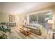 Inviting living room with a neutral palette, comfortable seating, and a bright, airy feel at 601 W Old Us Highway 441 # 9B, Mount Dora, FL 32757
