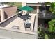 This spacious patio features an outdoor dining set, lounge seating, and a grill for entertaining and relaxation at 601 W Old Us Highway 441 # 9B, Mount Dora, FL 32757