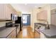 Charming kitchen features stainless steel appliances, sleek counter tops, and light filled eating area at 6274 Bristol Channel Way, Orlando, FL 32829