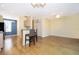 Open concept living area with hardwood floors, breakfast bar, and modern ceiling fan at 6274 Bristol Channel Way, Orlando, FL 32829