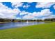 Scenic view of the community pond with fountain at 6274 Bristol Channel Way, Orlando, FL 32829