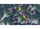 Aerial view of townhomes with well-maintained roofs, nestled among lush greenery and mature trees at 6364 Raleigh St # 1615, Orlando, FL 32835