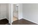 View of the bathroom with white cabinets, a granite counter, and wood floors at 6364 Raleigh St # 1615, Orlando, FL 32835