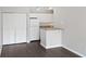 Open-concept kitchen featuring modern appliances and a breakfast bar at 6364 Raleigh St # 1615, Orlando, FL 32835