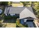 Aerial view of a single-Gathering home with a well-maintained roof, tidy yard, and an attached one-car garage at 6713 Cherry Rd, Ocala, FL 34472