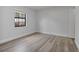 Charming bedroom with neutral walls, modern floors, and closet space at 6713 Cherry Rd, Ocala, FL 34472