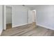 Bright bedroom with neutral walls, newly installed floors, and closet at 6713 Cherry Rd, Ocala, FL 34472