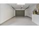 Empty two-car garage, freshly painted, and ready for your vehicles at 6713 Cherry Rd, Ocala, FL 34472