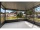Screened-in patio perfect for relaxing with a view of the backyard at 6713 Cherry Rd, Ocala, FL 34472