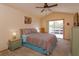 Comfortable bedroom featuring a large window, vaulted ceilings, and calming colors at 787 E Charing Cross Cir, Lake Mary, FL 32746