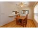 Cozy dining room featuring a wooden table set and a ceiling fan for comfortable dining at 787 E Charing Cross Cir, Lake Mary, FL 32746