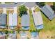 Aerial view of a home showcasing a screened-in pool and surrounding properties at 7911 Magnolia Bend Ct, Kissimmee, FL 34747