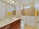 Accessible bathroom with a walk-in tub, modern vanity, and ample space, designed for comfort and convenience at 801 San Raphael St, Poinciana, FL 34759