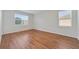 Bright bedroom features hardwood floors and natural light from windows at 801 San Raphael St, Poinciana, FL 34759
