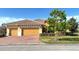 Charming single-Gathering home featuring a well-manicured lawn, red brick driveway, and a spacious three-car garage at 801 San Raphael St, Poinciana, FL 34759