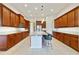 Modern kitchen featuring granite countertops, ample cabinet space, stainless steel appliances, and an island with bar seating at 801 San Raphael St, Poinciana, FL 34759