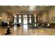 Spacious lobby with tiled flooring, elegant chandeliers, and comfortable seating areas at 801 San Raphael St, Poinciana, FL 34759