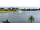 Picturesque pond featuring a fountain, surrounded by lush landscaping, offering a serene and tranquil setting at 801 San Raphael St, Poinciana, FL 34759