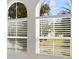 Arched windows offer views of the exterior landscape at 801 San Raphael St, Poinciana, FL 34759